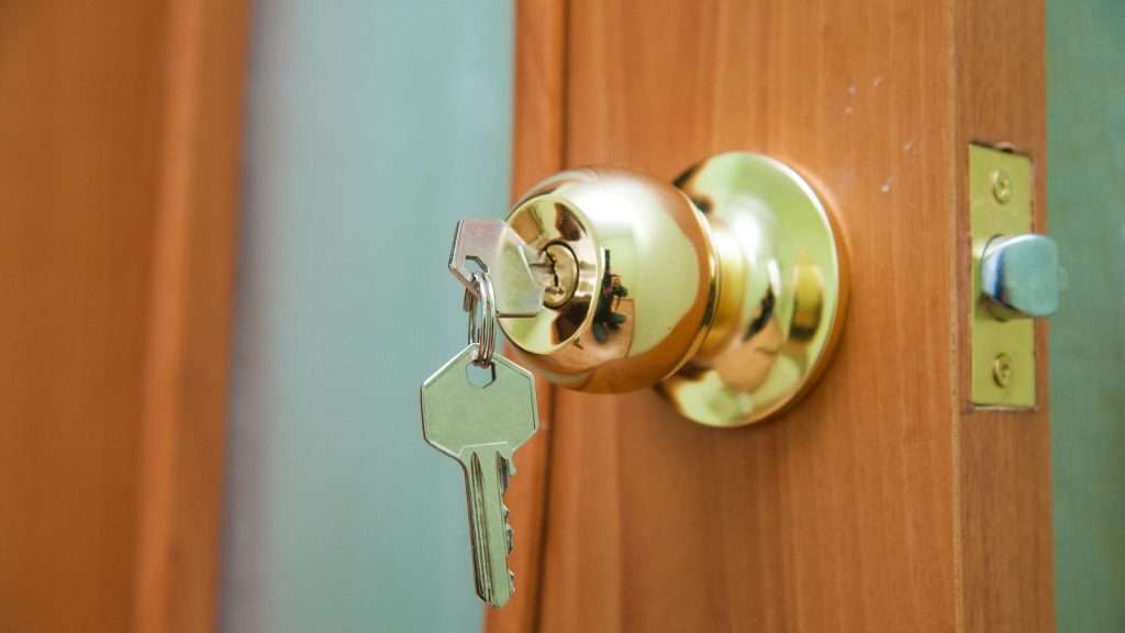 An image of home locks with inserted key.