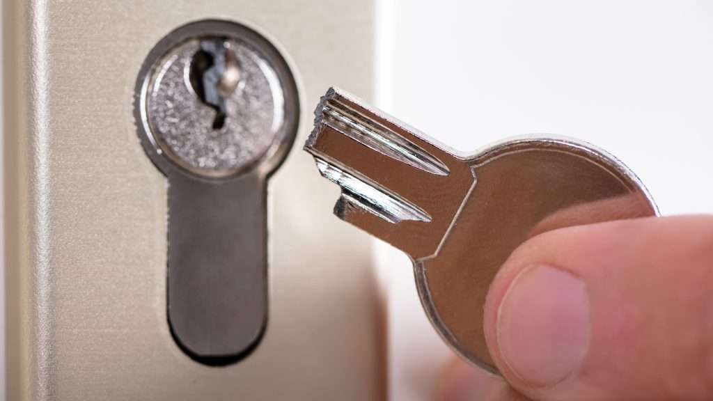 A user holding a broken key. Broken keys stuck inside locks are among the most common commercial lock problems
