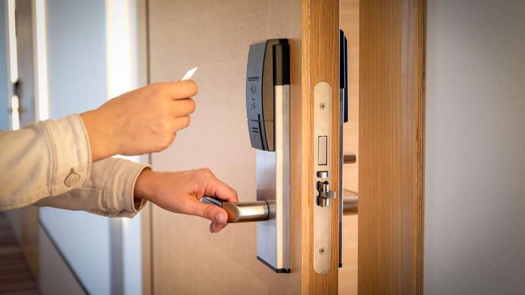 A user opening a magnetic lock with an access card