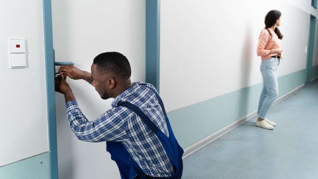 A technician responding to a service call for house lockouts