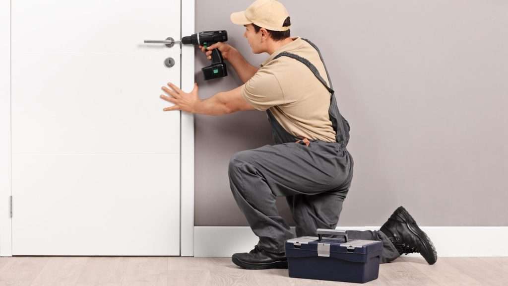 A mobile residential locksmith working on a lock
