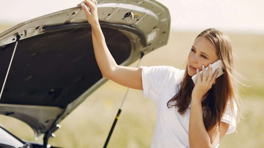 A woman calling for roadside assistance