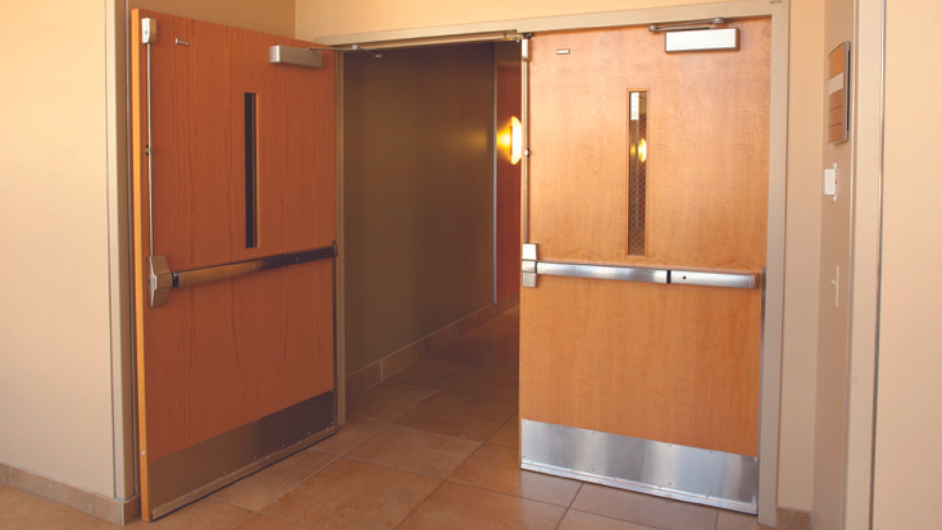 Panic bars equipped on theater exit doors to facilitate quick and safe egress during emergencies.