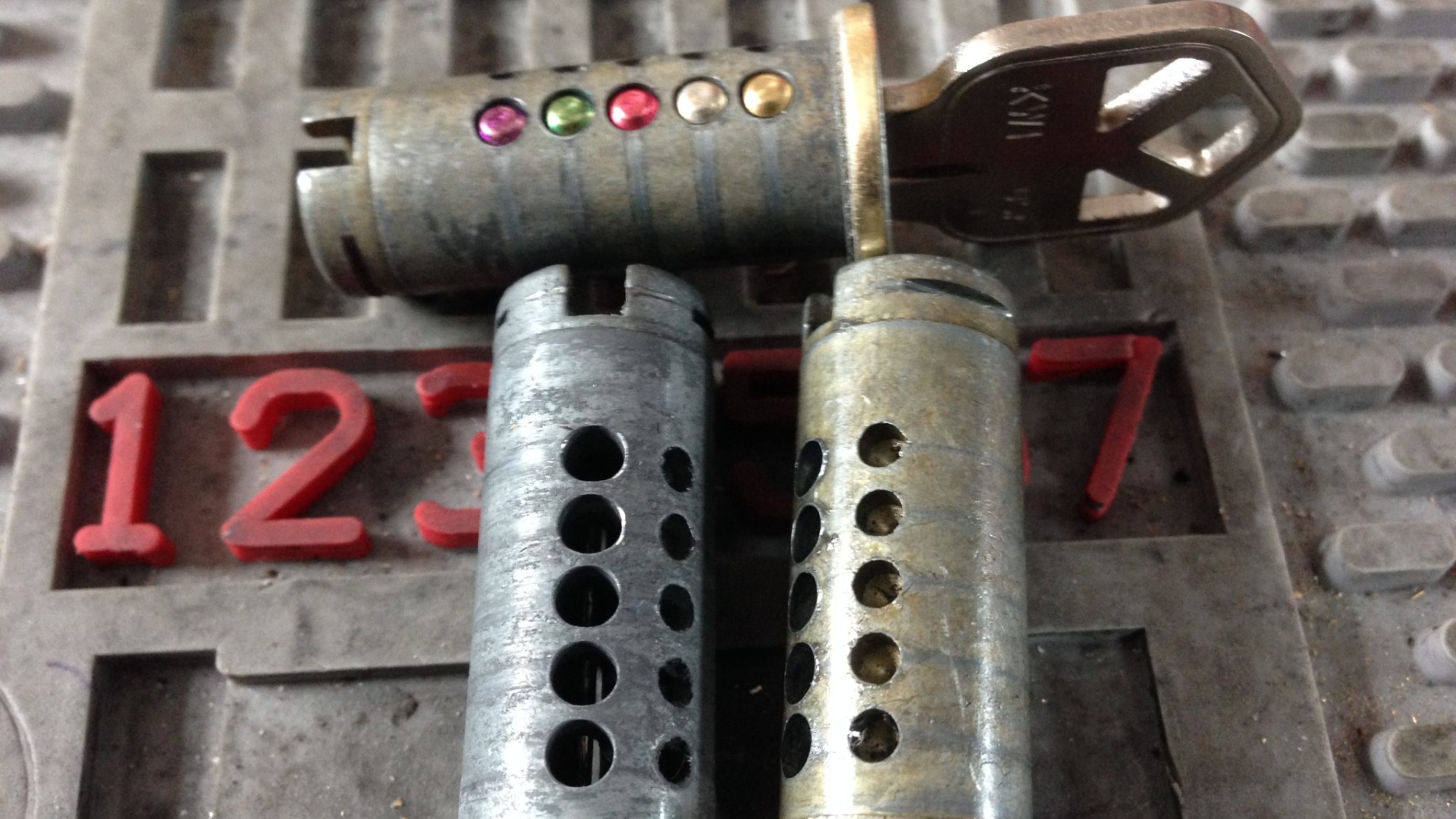 Close-up of disassembled plugs from lock cylinders