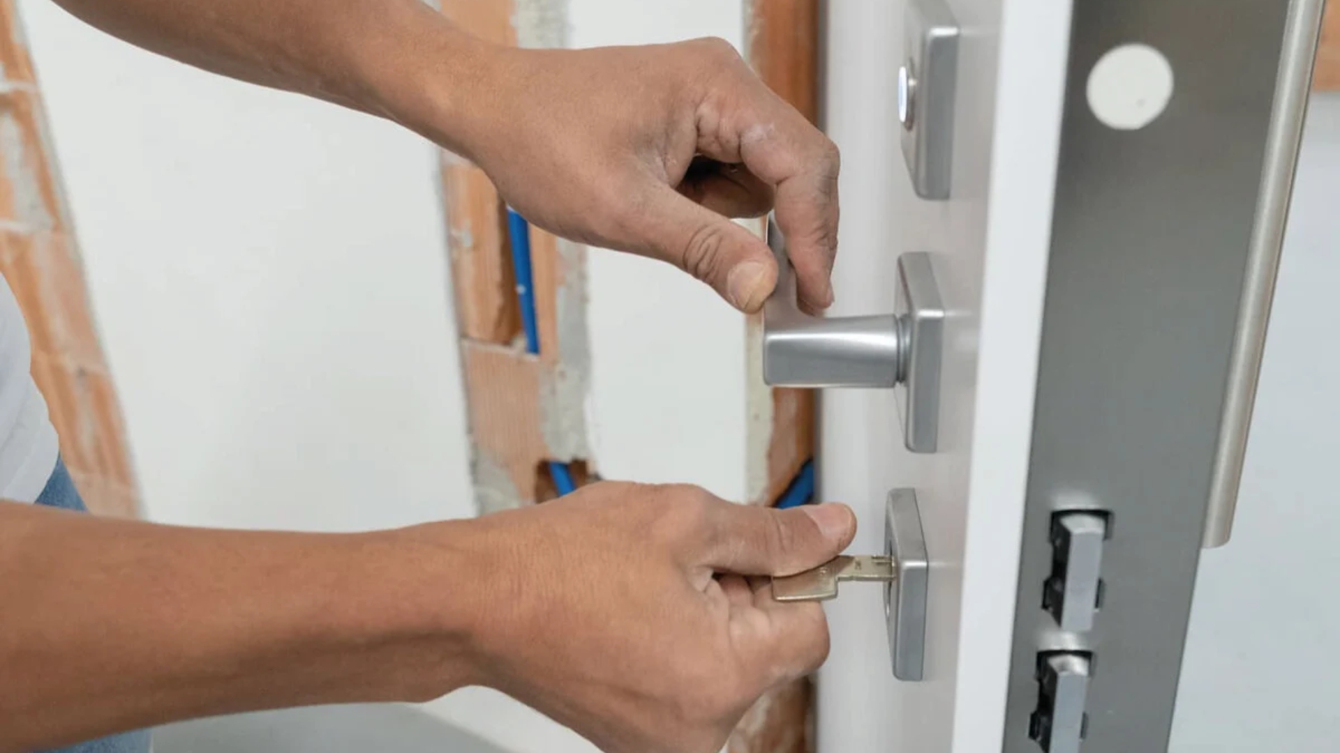 Inserting a key into a commercial door lock