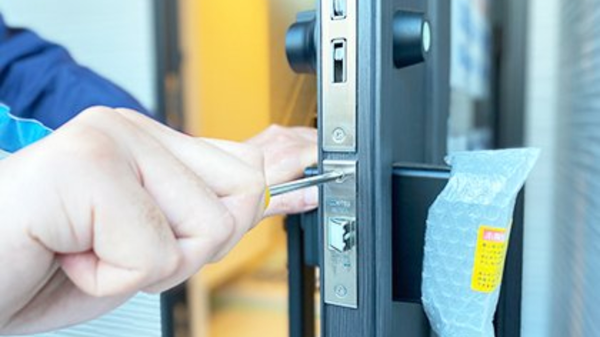 Commercial door lock repair in progress