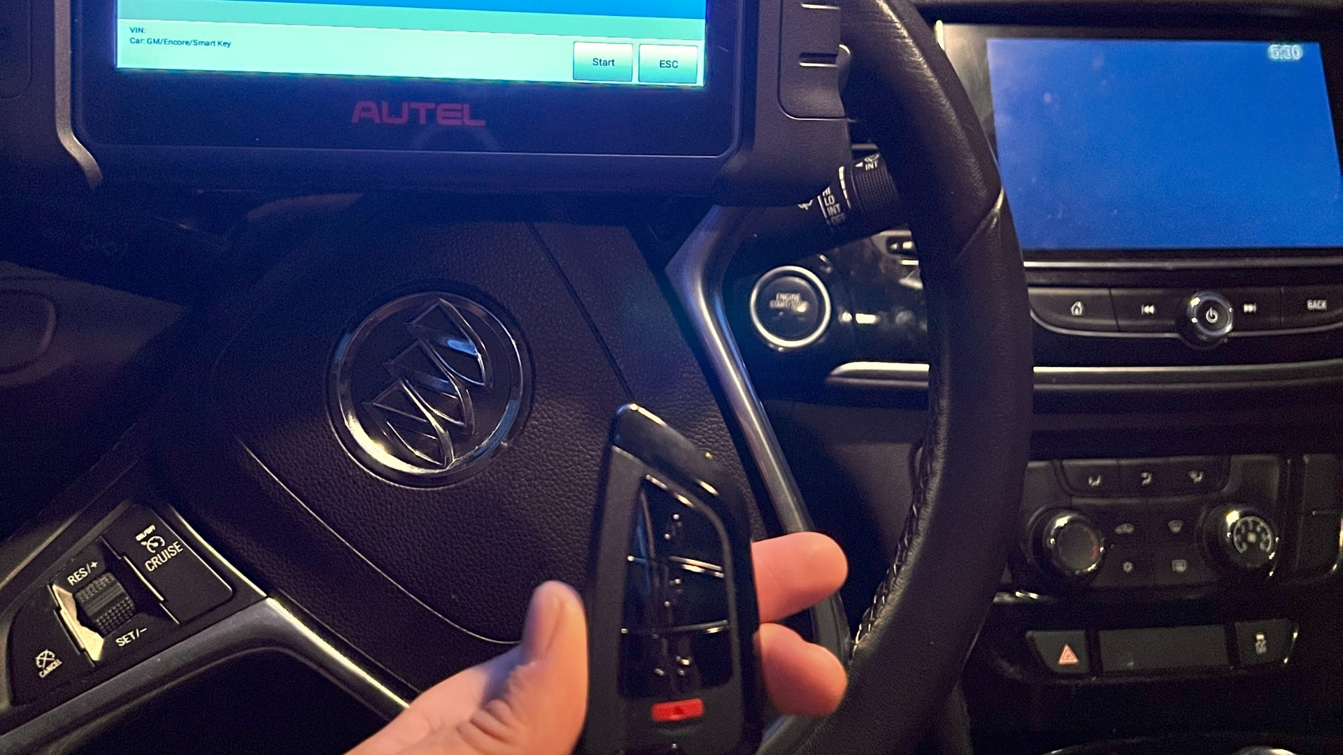 Key fob programming using a diagnostic tool inside a car during mobile locksmith service